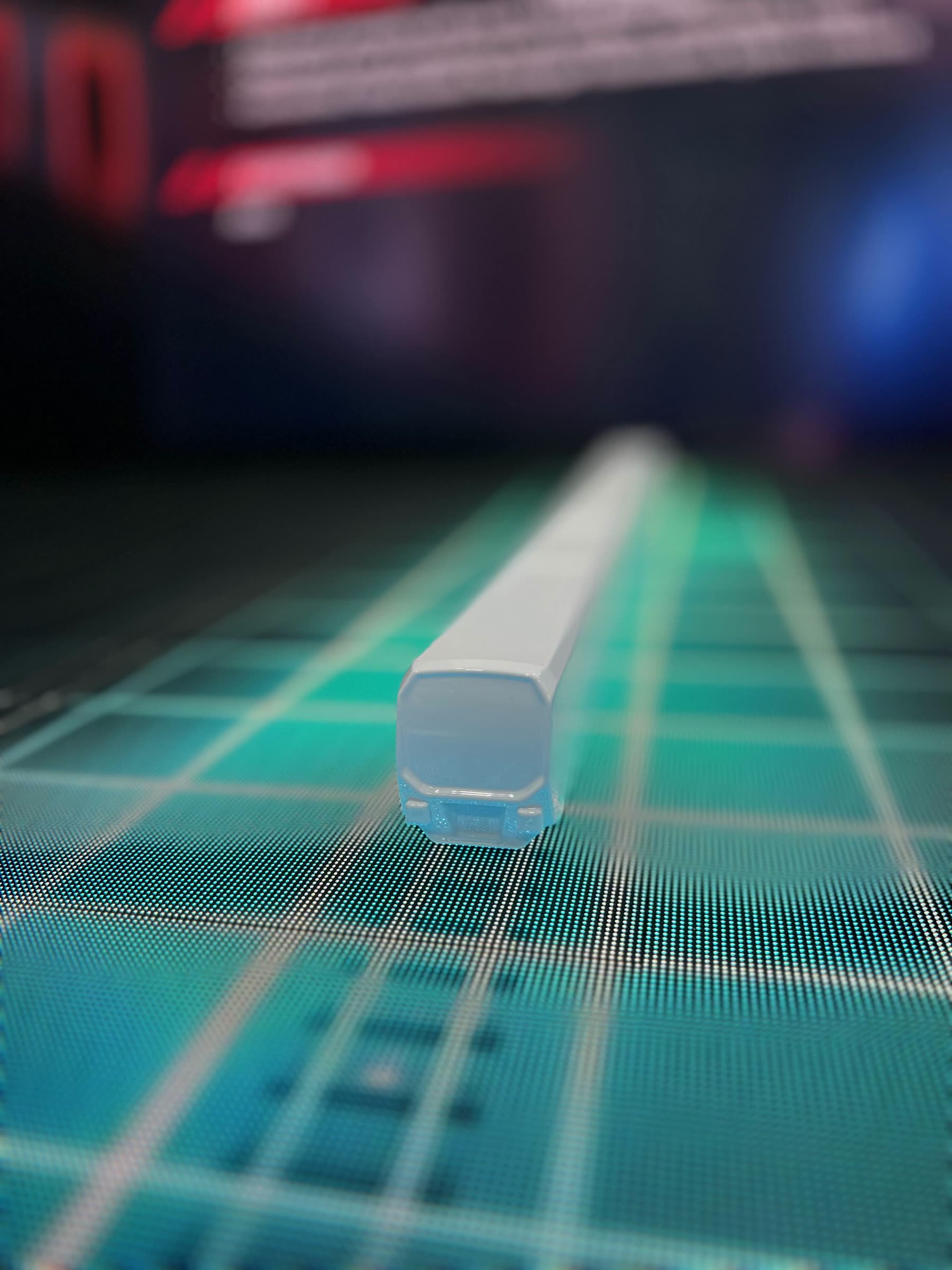 Close-up of a train model on the LED floor display