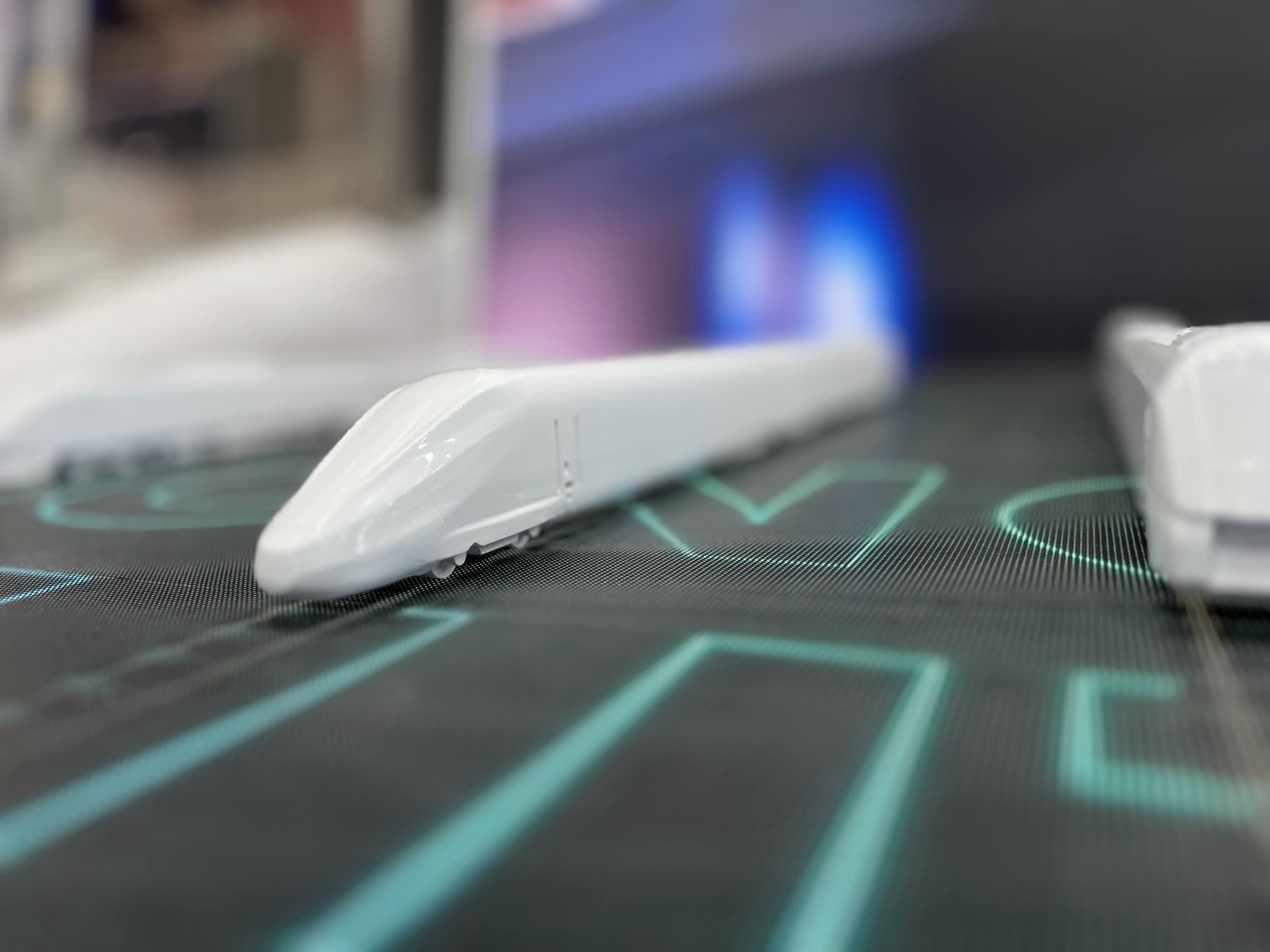 Small train model on the LED display with track graphics