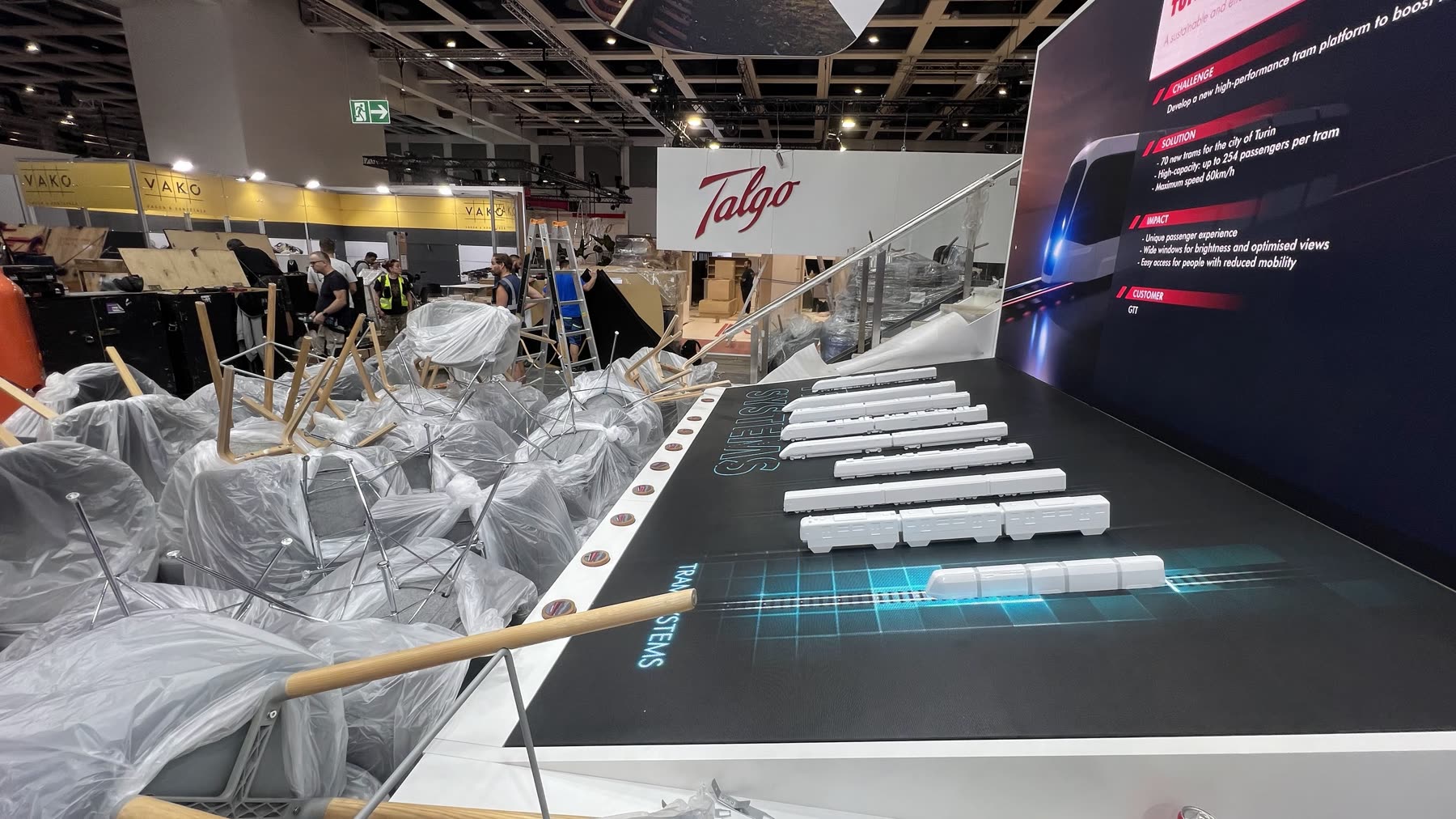 Wide view of the trade-show stand with train models