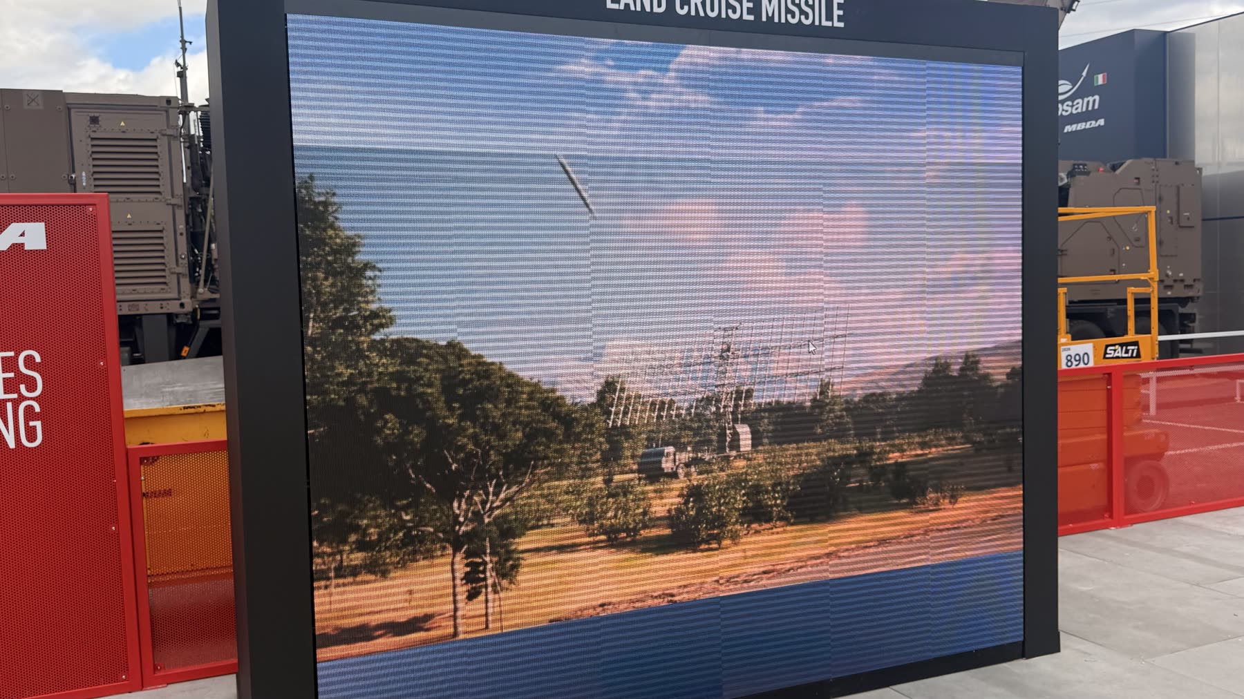 LED screen showing a missile in flight over a radar installation