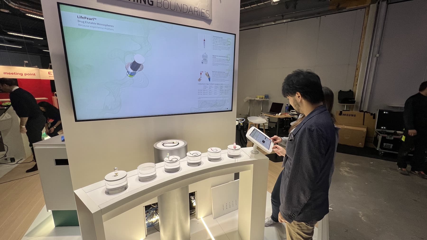 Visitors using the Terumo product catalogue at ECIO 2023