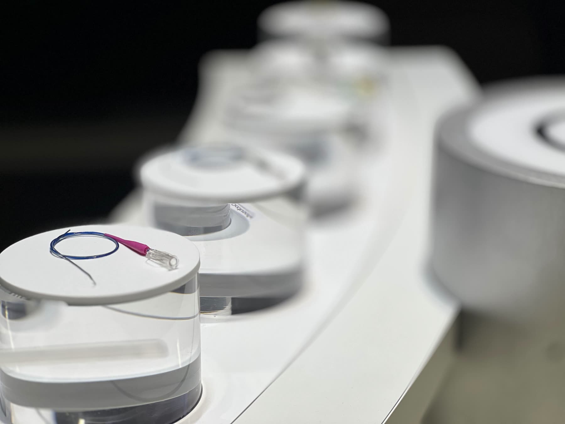 Row of NFC product pucks on the stand